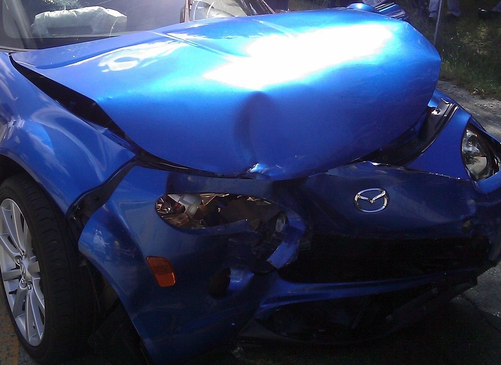 Front bumper collision damage before repair